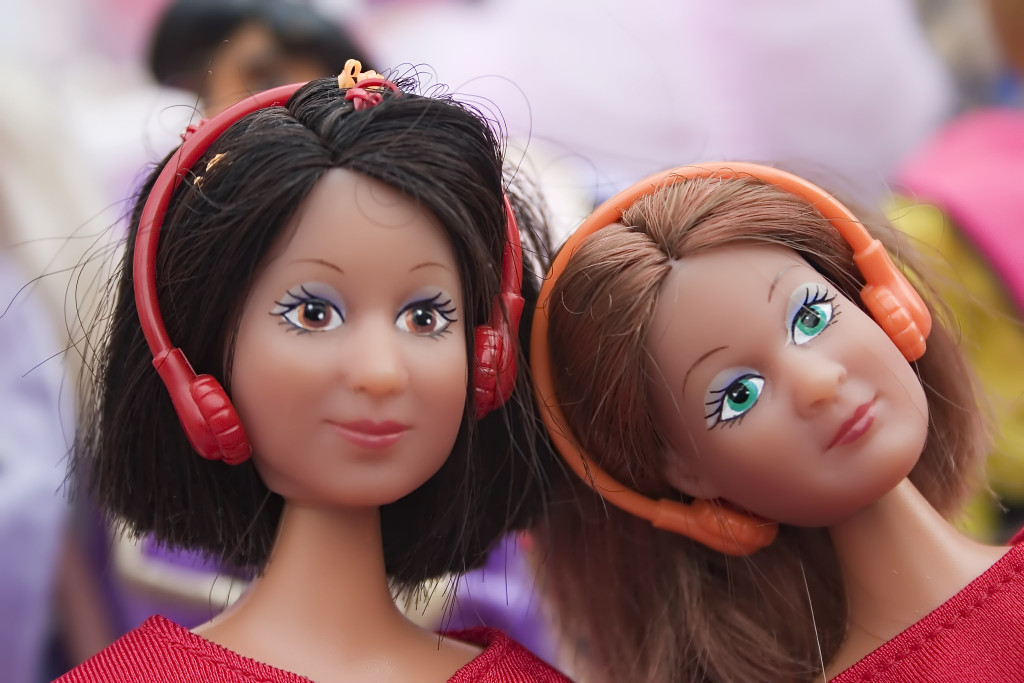 Two Barbie dolls with walkman and headphone